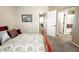 Spacious bedroom with a large bed and views of the hallway at 1427 Deerwood Dr, Longmont, CO 80504