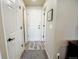 Entryway features neutral walls, hardwood flooring, and white doors, creating a bright and inviting space at 1427 Deerwood Dr, Longmont, CO 80504