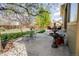 Relaxing backyard patio area with water feature and seating, perfect for entertaining at 1427 Deerwood Dr, Longmont, CO 80504