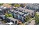 An aerial view showcasing a modern townhome community, with sleek designs, rooftop decks, and lush landscaping in Denver, CO at 2790 W 25Th Ave # 6, Denver, CO 80211