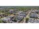 An aerial view of a neighborhood with rows of modern townhomes surrounded by mature trees and foliage at 2790 W 25Th Ave # 6, Denver, CO 80211