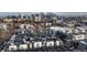 Urban neighborhood aerial view with modern townhouses and Denver skyline in the background at 2790 W 25Th Ave # 6, Denver, CO 80211