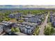 Aerial view of neighborhood featuring contemporary townhomes and lush greenery with mountain views in the background at 2790 W 25Th Ave # 6, Denver, CO 80211