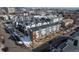 Aerial view showcasing modern townhouses with gray, white, and brick exteriors in an urban neighborhood at 2790 W 25Th Ave # 6, Denver, CO 80211