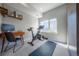 Well-lit bedroom with workout area and modern workstation at 2790 W 25Th Ave # 6, Denver, CO 80211