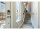 The foyer features tile floors, stairs leading to the upper level, and a view of the outdoors through a window at 2790 W 25Th Ave # 6, Denver, CO 80211