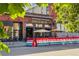 An inviting pub with outdoor seating, complemented by a colorful barrier and surrounded by urban charm in Denver, CO at 2790 W 25Th Ave # 6, Denver, CO 80211