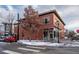 Two-story brick building with a pizza restaurant and vintage architectural details at 2790 W 25Th Ave # 6, Denver, CO 80211