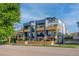 Modern townhome exterior featuring balconies and a contemporary design with a well-kept lawn and street view at 2790 W 25Th Ave # 6, Denver, CO 80211