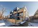 Modern townhomes showcasing a contemporary design, private balconies, and a well-maintained wooden perimeter fence at 2790 W 25Th Ave # 6, Denver, CO 80211