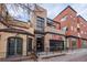 Contemporary building with brick facade, black accents, and Red Tops Rendezvous signage at 2790 W 25Th Ave # 6, Denver, CO 80211