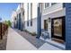 Inviting front porch with a cozy chair and stylish front door at 2790 W 25Th Ave # 6, Denver, CO 80211