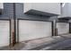 Attached garages with white doors offer secure and convenient parking at 2790 W 25Th Ave # 6, Denver, CO 80211