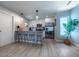 Modern kitchen featuring a stylish breakfast bar, stainless steel appliances, and contemporary pendant lighting at 2790 W 25Th Ave # 6, Denver, CO 80211