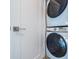 Efficient laundry area with a stacked Samsung washer and dryer at 2790 W 25Th Ave # 6, Denver, CO 80211