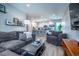 Open-concept living room flowing into a modern kitchen with bar seating at 2790 W 25Th Ave # 6, Denver, CO 80211