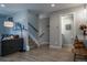 Inviting space with a cozy seating area, staircase, and a glimpse into a modern half-bathroom, exuding comfort at 2790 W 25Th Ave # 6, Denver, CO 80211