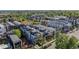 View of neighborhood with modern townhomes featuring rooftop patios and contemporary design, surrounded by mature trees and green spaces at 2790 W 25Th Ave # 6, Denver, CO 80211