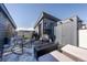 Inviting rooftop deck with modern seating, fire pit, grill, and storage on a sunny day at 2790 W 25Th Ave # 6, Denver, CO 80211