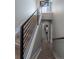 Modern staircase with wood steps and black metal railing at 2790 W 25Th Ave # 6, Denver, CO 80211