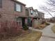 Attractive townhomes with brick and siding exteriors, private patios, and sidewalk access at 559 Alton Way # C, Denver, CO 80230