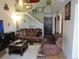 Inviting living room with plush leather seating, stairs, and stylish decor at 559 Alton Way # C, Denver, CO 80230