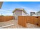 Cozy backyard with gravel and secure wooden fencing at 13029 E 103Rd Pl, Commerce City, CO 80022