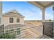 A view from the balcony showcasing the neighborhood and the adjacent house at 13029 E 103Rd Pl, Commerce City, CO 80022