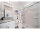 Clean bathroom featuring a shower, white cabinets, granite countertop and sink at 13029 E 103Rd Pl, Commerce City, CO 80022