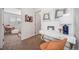 Upstairs landing with modern desk and chair leading to a bedroom at 13029 E 103Rd Pl, Commerce City, CO 80022