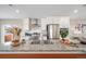 Close-up view of a granite countertop island, with stainless steel appliances and white cabinets in background at 13029 E 103Rd Pl, Commerce City, CO 80022