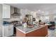 Well-equipped kitchen with stainless steel appliances, granite countertops, and open layout at 13029 E 103Rd Pl, Commerce City, CO 80022