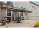 Cozy backyard patio includes outdoor seating and a barbecue with a privacy fence at 9954 W Progress Pl, Littleton, CO 80123