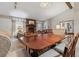 Open-concept living area with combined dining, comfortable furniture, and a cozy fireplace at 9954 W Progress Pl, Littleton, CO 80123