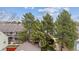 Aerial view of townhomes with trees and well-maintained landscaping on a bright day at 9954 W Progress Pl, Littleton, CO 80123