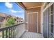 Charming balcony with a view of the neighborhood and a door for convenient access at 7440 S Blackhawk St # 14-208, Englewood, CO 80112