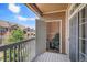 View into balcony storage with Christmas decorations from the outdoor balcony overlooking the neighborhood at 7440 S Blackhawk St # 14-208, Englewood, CO 80112