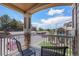 Private balcony shows lovely view of neighboring condos and green space from seating area at 7440 S Blackhawk St # 14-208, Englewood, CO 80112