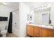 Functional bathroom featuring double sinks, generous vanity space, and a shower-tub combination at 7440 S Blackhawk St # 14-208, Englewood, CO 80112