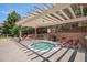 Community hot tub with pergola and lounge chairs for relaxation at 7440 S Blackhawk St # 14-208, Englewood, CO 80112