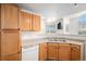 Kitchen offers generous storage cabinets and view to adjacent rooms at 7440 S Blackhawk St # 14-208, Englewood, CO 80112