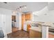 Well-lit kitchen offering plenty of counter space, natural wood cabinets, and modern appliances at 7440 S Blackhawk St # 14-208, Englewood, CO 80112