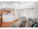 Cozy living room with open floor plan, breakfast bar, and adjacent access to the kitchen at 7440 S Blackhawk St # 14-208, Englewood, CO 80112