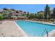 Community pool with lounge chairs and beautiful landscaping at 7440 S Blackhawk St # 14-208, Englewood, CO 80112
