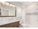 Bathroom with a soaking tub, shower, and a vanity with a marble countertop at 12467 Topaz Vista Way, Castle Pines, CO 80108