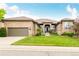 Beautiful stone and stucco home featuring an attached garage and professionally landscaped yard at 12467 Topaz Vista Way, Castle Pines, CO 80108