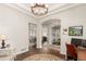 Open foyer featuring hardwood floors, an arched doorway, recessed lighting, and access to multiple rooms at 12467 Topaz Vista Way, Castle Pines, CO 80108
