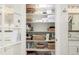 Well-organized linen closet, maximizing storage with multiple shelves and ample space for towels and essentials at 12467 Topaz Vista Way, Castle Pines, CO 80108