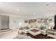 Open basement living room with carpet flooring, and a wet bar at 12467 Topaz Vista Way, Castle Pines, CO 80108