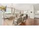 Spacious living room featuring hardwood floors, a gorgeous light fixture, and an open layout at 12467 Topaz Vista Way, Castle Pines, CO 80108